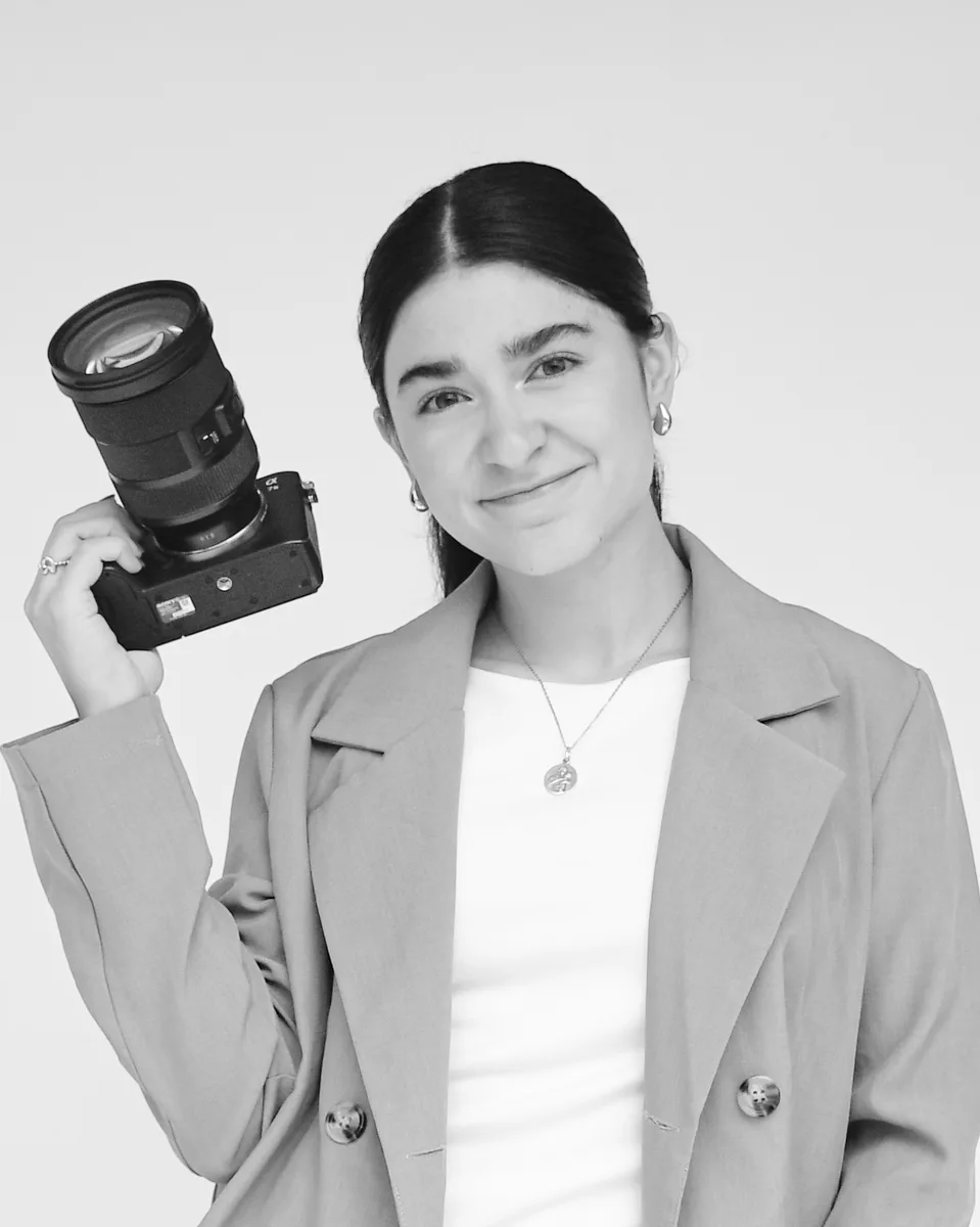 Ana Sofía Santillana holding her camera